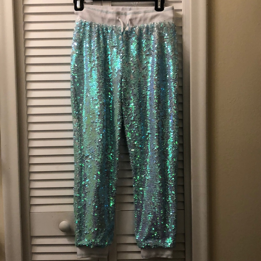 More Than Magic sequin-flip teal/white joggers.
